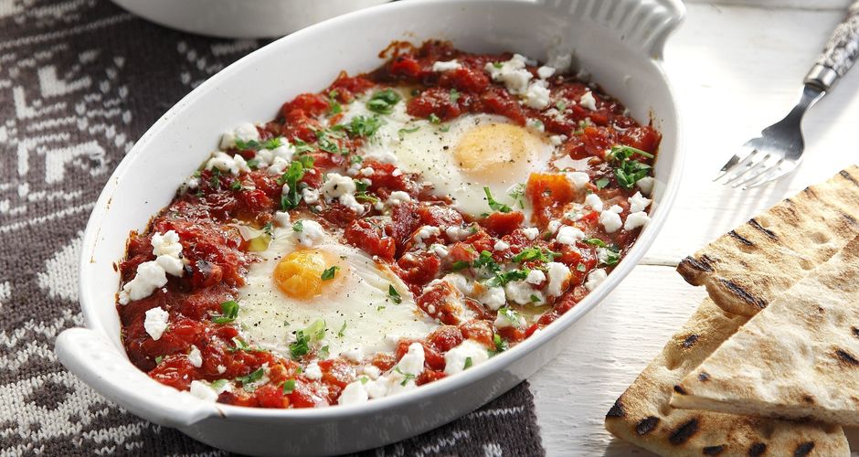 Poached gegs in a spicy tomato sauce