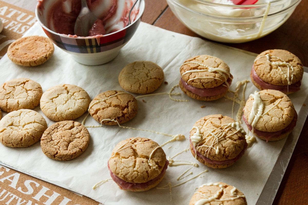 Almond hazelnut sandwich cookies with a strawberry white chocolate